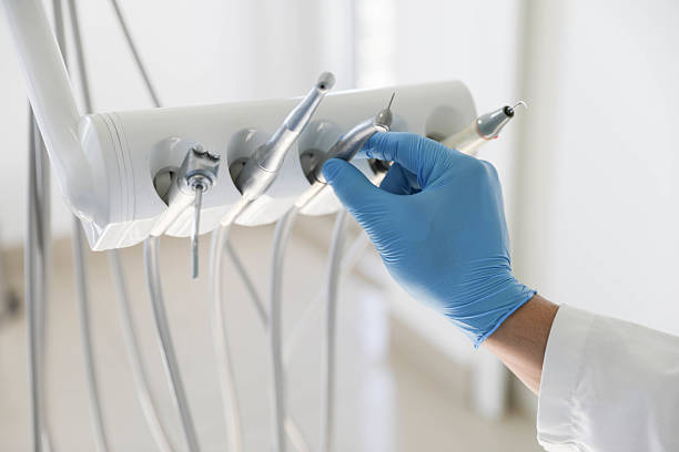 Professional Tooth Extraction technician working in Morganville, NJ